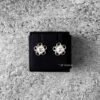 Chanel Logo Clear Pearl and Steel Silver Hardware Earrings