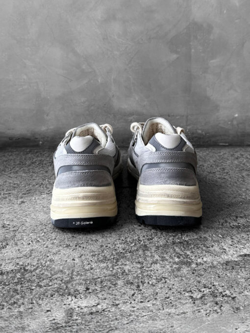 Golden Goose Dad-Star sneakers in suede and silver mesh, combining retro-inspired style with signature distressed detailing.