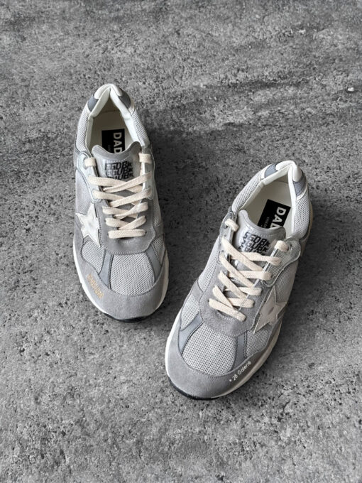 Golden Goose Dad-Star sneakers in suede and silver mesh, combining retro-inspired style with signature distressed detailing.