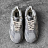 Golden Goose Dad-Star sneakers in suede and silver mesh, combining retro-inspired style with signature distressed detailing.
