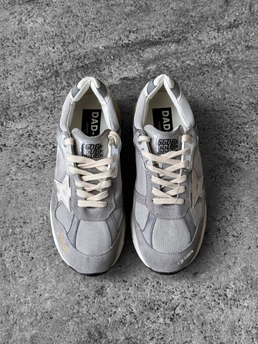 Golden Goose Dad-Star sneakers in suede and silver mesh, combining retro-inspired style with signature distressed detailing.