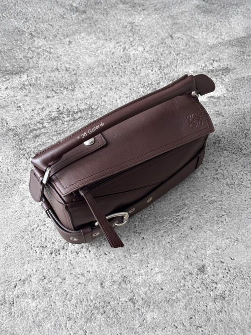 Loewe Small Dark Brownie Puzzle Biker Bag in calfskin leather, blending the iconic Puzzle design with bold biker-inspired detailing.
