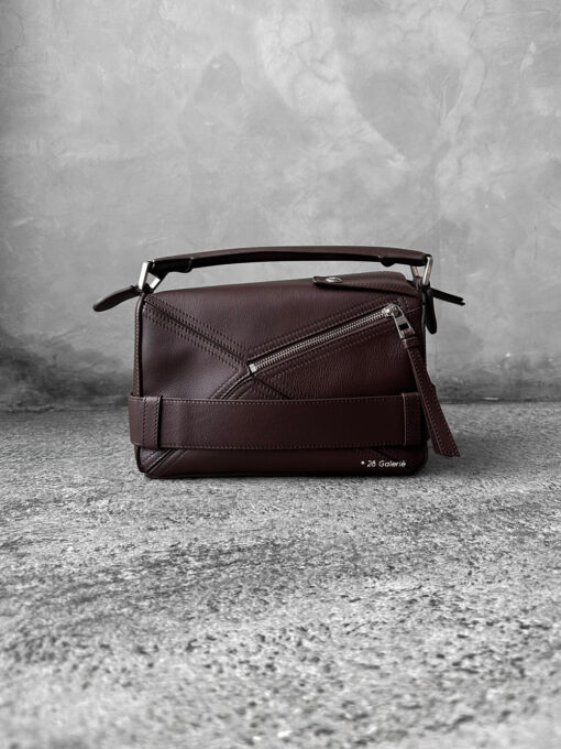 Loewe Small Dark Brownie Puzzle Biker Bag in calfskin leather, blending the iconic Puzzle design with bold biker-inspired detailing.