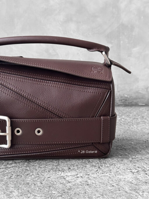 Loewe Small Dark Brownie Puzzle Biker Bag in calfskin leather, blending the iconic Puzzle design with bold biker-inspired detailing.