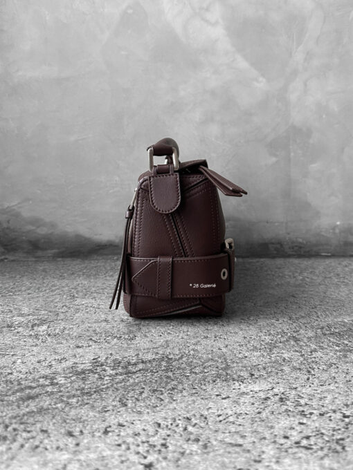 Loewe Small Dark Brownie Puzzle Biker Bag in calfskin leather, blending the iconic Puzzle design with bold biker-inspired detailing.