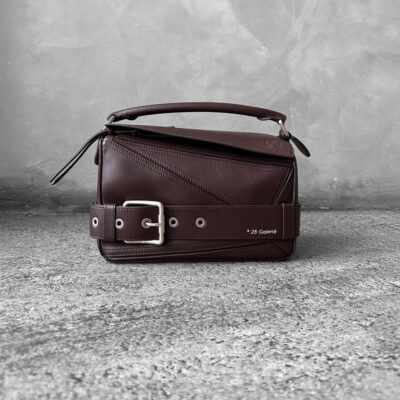 Loewe Small Dark Brownie Puzzle Biker Bag in calfskin leather, blending the iconic Puzzle design with bold biker-inspired detailing.