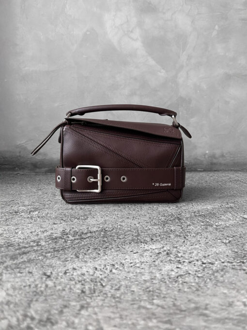 Loewe Small Dark Brownie Puzzle Biker Bag in calfskin leather, blending the iconic Puzzle design with bold biker-inspired detailing.