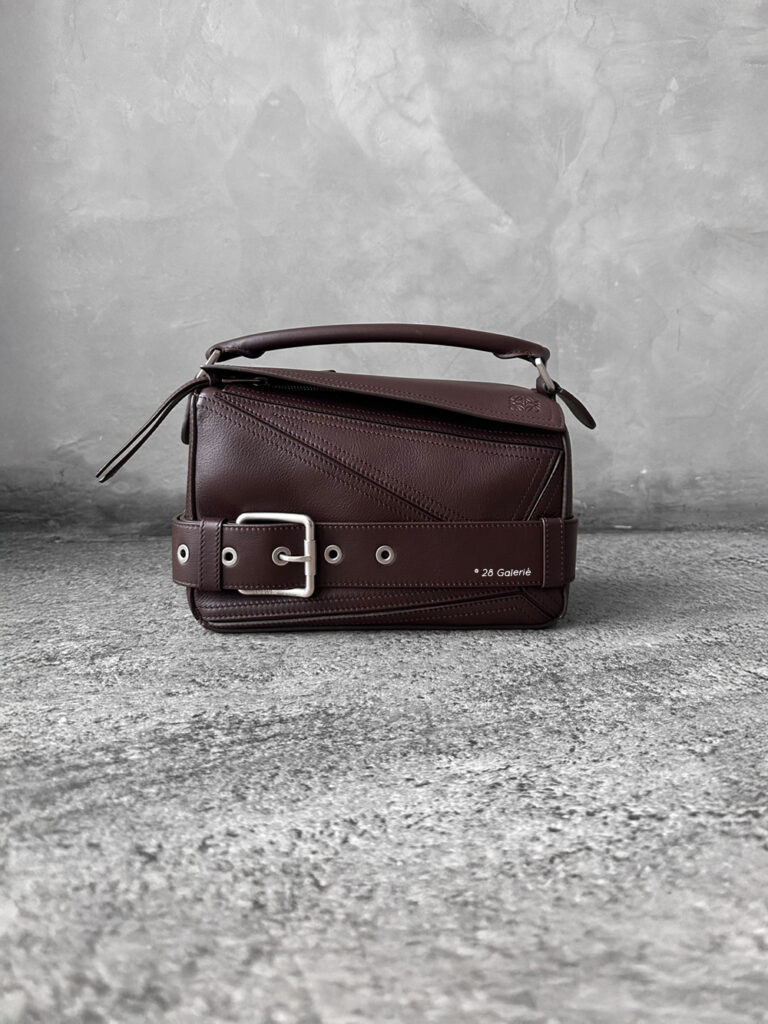 Loewe Small Dark Brownie Puzzle Biker Bag in calfskin leather, blending the iconic Puzzle design with bold biker-inspired detailing.