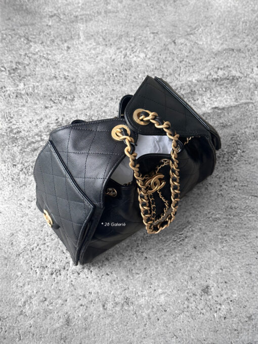 Small Black C25 Quilted Caviar bag with aged gold-tone hardware. A classic, compact design that exudes timeless elegance and versatile style.