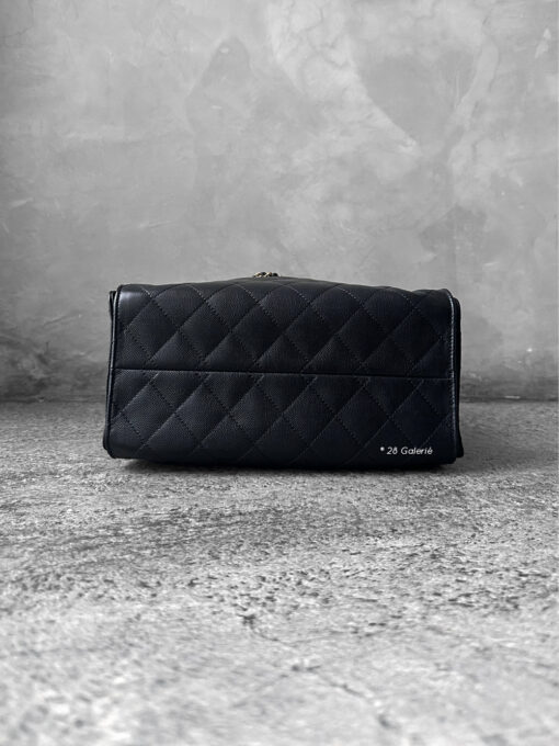 Small Black C25 Quilted Caviar bag with aged gold-tone hardware. A classic, compact design that exudes timeless elegance and versatile style.