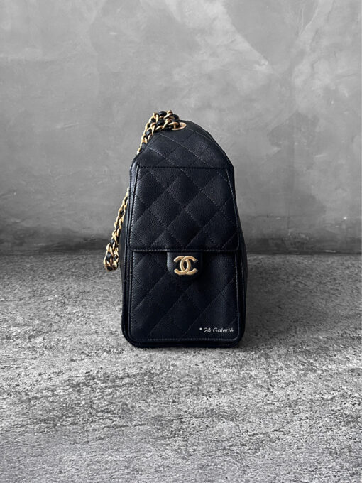 Small Black C25 Quilted Caviar bag with aged gold-tone hardware. A classic, compact design that exudes timeless elegance and versatile style.