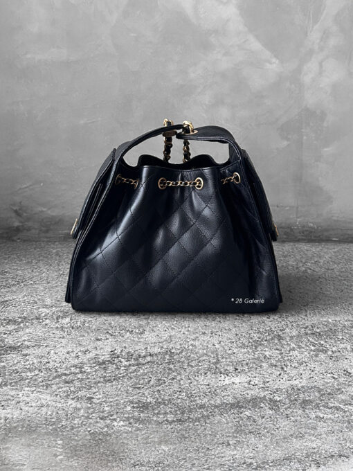 Small Black C25 Quilted Caviar bag with aged gold-tone hardware. A classic, compact design that exudes timeless elegance and versatile style.