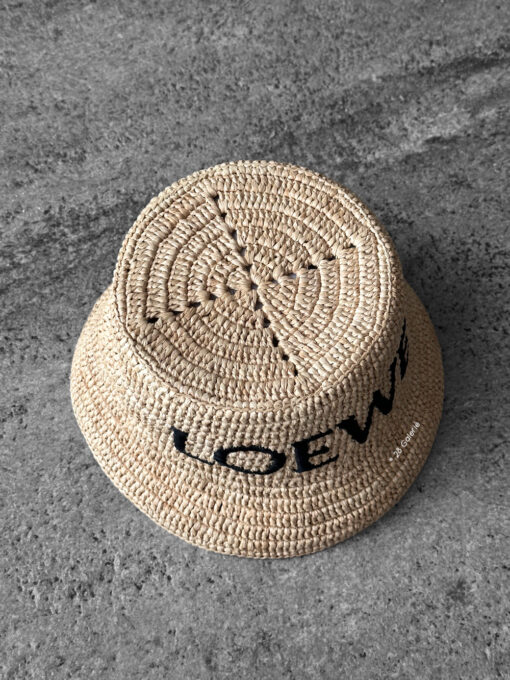 Loewe Natural Raffia Bucket Hat, a lightweight woven design with casual elegance and signature luxury detailing.