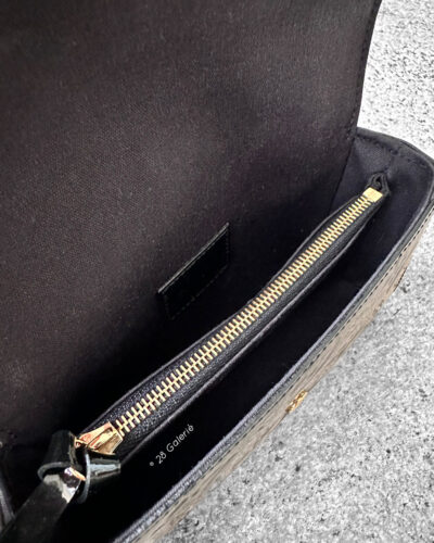 Louis Vuitton Black Patent Pochette Lucy Monogram Vernis Pouch, a sleek and compact design in glossy patent leather with timeless LV elegance.