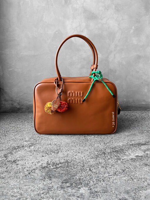 Miu Miu Cognac Large Leather Beau Bag, a structured and spacious design that blends timeless elegance with modern sophistication.