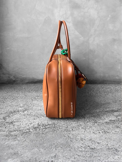 Miu Miu Cognac Large Leather Beau Bag, a structured and spacious design that blends timeless elegance with modern sophistication.