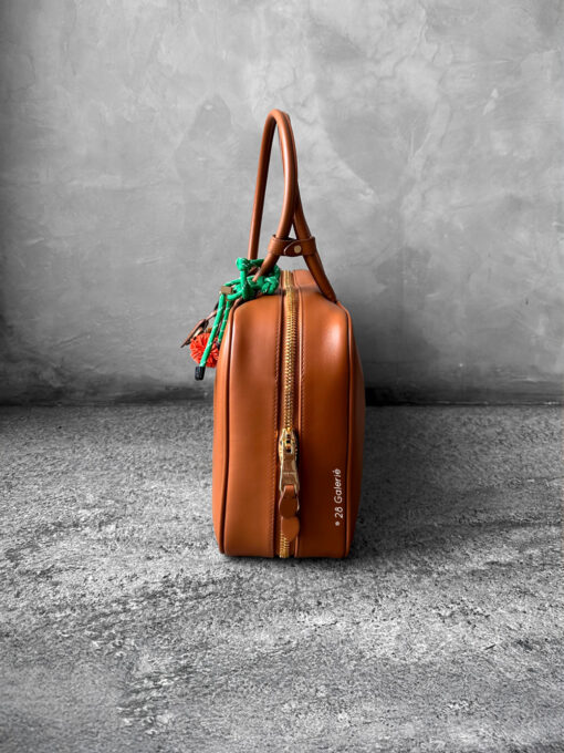 Miu Miu Cognac Large Leather Beau Bag, a structured and spacious design that blends timeless elegance with modern sophistication.
