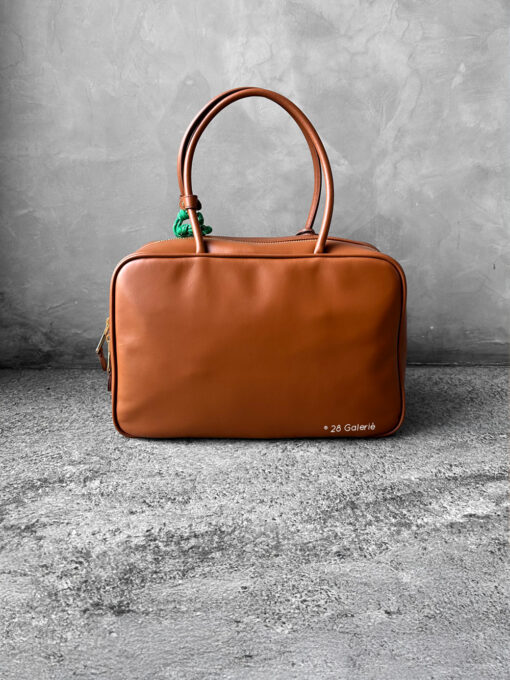 Miu Miu Cognac Large Leather Beau Bag, a structured and spacious design that blends timeless elegance with modern sophistication.