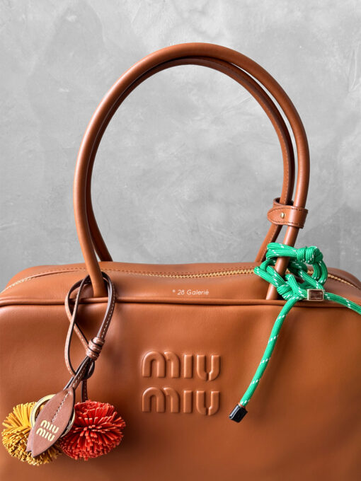 Miu Miu Cognac Large Leather Beau Bag, a structured and spacious design that blends timeless elegance with modern sophistication.