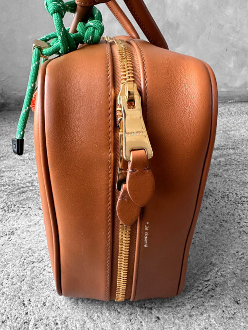 Miu Miu Cognac Large Leather Beau Bag, a structured and spacious design that blends timeless elegance with modern sophistication.