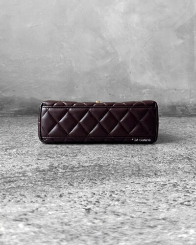 Chanel Dark Brown Mini Kelly Shopping Tote in shiny calfskin leather with gold hardware. A chic, structured design that blends elegance with everyday style.