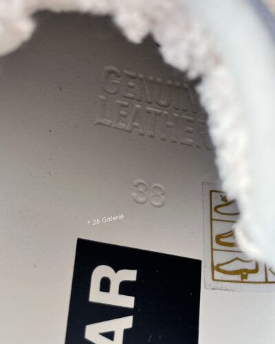 Golden Goose Dad-Star sneakers in suede and silver mesh, combining retro-inspired style with signature distressed detailing.