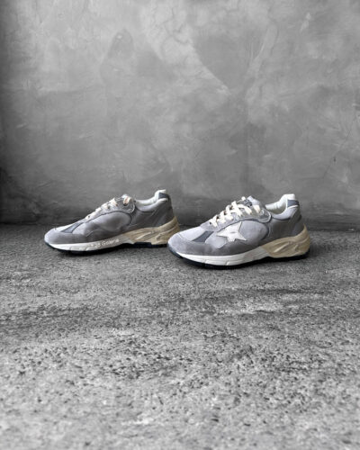 Golden Goose Dad-Star sneakers in suede and silver mesh, combining retro-inspired style with signature distressed detailing.