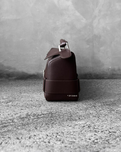 Loewe Small Dark Brownie Puzzle Biker Bag in calfskin leather, blending the iconic Puzzle design with bold biker-inspired detailing.