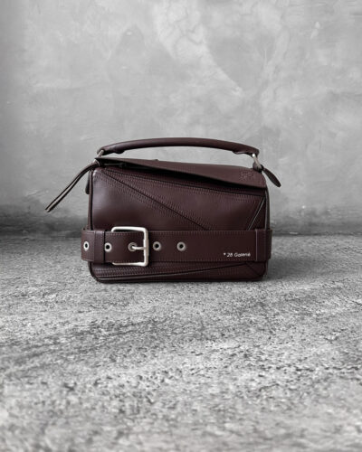 Loewe Small Dark Brownie Puzzle Biker Bag in calfskin leather, blending the iconic Puzzle design with bold biker-inspired detailing.