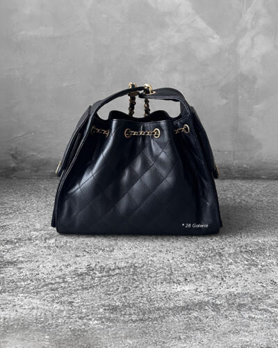 Small Black C25 Quilted Caviar bag with aged gold-tone hardware. A classic, compact design that exudes timeless elegance and versatile style.