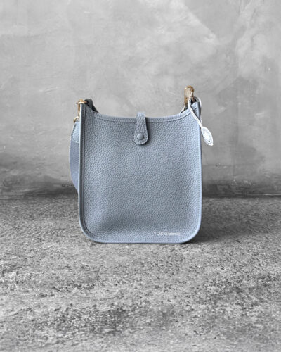 Hermès Bleu Glacier Evelyne 16 Amazone Bag, a compact crossbody in Clemence leather with signature perforated H logo and canvas strap.