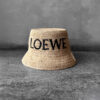 Loewe Natural Raffia Bucket Hat, a lightweight woven design with casual elegance and signature luxury detailing.