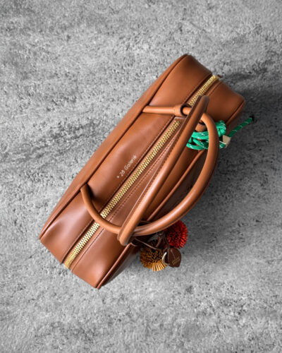 Miu Miu Cognac Large Leather Beau Bag, a structured and spacious design that blends timeless elegance with modern sophistication.