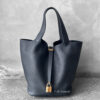 Hermès Noir Picotin in Clemence leather with gold hardware, a classic and elegant bucket-style tote crafted with signature Hermès refinement.